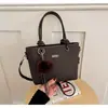 Bolso de mano retro simple transfronterizo bolso pequeño para mujer nuevo elegante diseño de nicho bolso cubo versátil bolso de hombro único bandolera