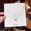 Collar de acero de titanio ligero de lujo de estilo japonés y coreano para mujer, colgante de circonita con microincrustaciones que combina con todo, cadena de clavícula con lazo estilo Ins, venta al por mayor