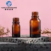 En stock: Botellas de aceite esencial de 15 ml de color ámbar, Botellas de vidrio marrón de 5 ml resistentes a la luz, Botellas de vidrio dispensadoras para productos de cuidado de la piel, Botellas vacías para loción