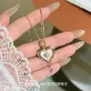 Colar de borla em forma de coração estilo palácio retrô, exalando uma vibe luxuosa e fashion, com um design único e criativo, tornando-o um acessório versátil e requintado
