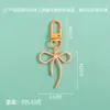 Nuevo estilo princesa fugitiva lindo llavero de lazo accesorio colgante simple DIY colgante de cuentas material al por mayor