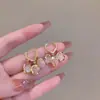 2025 Nuevos Nuevos Pendientes de Hebilla para Oreja de Ojo de Gato Triple Suzuki para Mujer Diseño Antiperdido Pendientes de Nicho