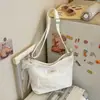 Bolsa de ombro casual transfronteiriça nova 2026, estilo coreano da moda, simples e jovial, versátil para o uso diário