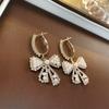Pendientes de perla de aguja de plata galvanizada con oro real, pendientes de estilo cortesano de moda de alto sentido, pendientes de temperamento retro francés, venta al por mayor