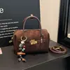 Bolso de mano Boston de gamuza vintage transfronterizo para mujer, nuevo bolso nicho de alta moda tipo almohada, bolso de hombro y bandolera
