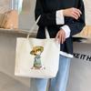 Bolsa de lona grande capacidade feminina 2023 novo estilo faculdade de arte estudantil bolsa de mão simples bolsa de ombro atacado
