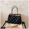 Bolso de mano de lona con lunares de gran capacidad para mujer, nuevo modelo 2026, de alta gama, lujo ligero, bolsa tote de nicho para el trabajo