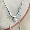 Collar con colgante de campana de mariposa de cerámica de estilo étnico retro para mujer, diseño nuevo y moderno, cadena larga para suéter, accesorios