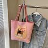 Mochila Biscuit Cat para mujer, otoño 2024, nueva bolsa de mano de estilo universitario de moda, bolso de hombro de gran capacidad de Corea del Sur.