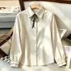 Comercio electrónico transfronterizo, AliExpress: Camisa de primavera/otoño con lazo bordado y detalle de atar, camisa de manga larga para mujer