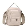 Bolso Pequeño Cuadrado de Tela de Nylon Impermeable Ligero Multicapa Transfronterizo Nuevo Bolso de Hombro Casual Multibolsillos Bolso Cruzado de Gran Capacidad
