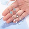 Pendientes de estrella para mujer, diseño de estrella de cinco puntas, largos, de cristal artificial azul, con nicho de sensación de viento frío, de cristal