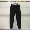 Pantalones Funcionales de Marca de Moda Stone Island Transfronterizos con Bolsillos Laterales con Logo Jogger Estilo Americano Pantalones de Chándal Versátiles Corte Holgado Ropa de Trabajo