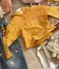 Blusa com Capuz Listrada de Manga Longa 2026 Novo Estilo Moda Menina Super Bonita Calça de Perna Larga com Estampa de Desenho para Bebê Menina