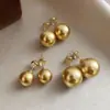 2025 Versión Mejorada Shijia Oro Té Personalizado Alto Brillo Luz Fuerte Perla Aretes Simples Moda Versátil Aretes Venta al por Mayor