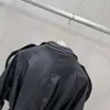 Chaqueta de Cuero PU de Manga Larga Transfronteriza Otoño/Invierno 2026 con Solapa, Diseño de Múltiples Botones, Cinturón, Estilo Motociclista, Corte Ajustado, Tendencia Minimalista Urbana