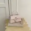 Bolsa pequena retro de estilo diário transfronteiriça para mulheres, nova bolsa de mão de nicho da moda, bolsa de ombro e transversal versátil e estilosa