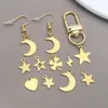 Colgante Hueco de Acero Inoxidable Dorado Trébol de Cuatro Hojas Luna Estrella de Cinco Puntas Colgante Pendientes DIY Llavero Accesorios de Joyería