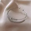 Pulsera Abierta Bicolor con Forma de Gota de Agua y Cruz Brillante Diseño de Pulsera de Personalidad Moda Europea y Americana Joyería de Nicho para Mujeres Venta al por Mayor