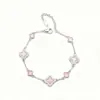 Pulsera de Trébol de Cuatro Hojas Cruzado de Cinco Pétalos Estilo de Lujo Ligero de Moda Sentido de Alta Gama Popular Rosa Flor de Cerezo Accesorios de Pulsera de Doble Cara