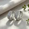 Pendientes de superventas transfronterizos europeos y americanos, cierres de oreja de circonita de cobre, totalmente incrustados de diamantes, adecuados para ir al trabajo, con un toque de lujo ligero y de alta gama, pendientes para mujer