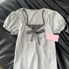 Camiseta con Estampado Floral de Lazo Falso Dos Piezas Mangas Abullonadas para Mujer Verano 2026 Nuevo Diseño Ajustado Dulce Manga Corta