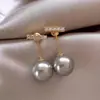 Nuevos pendientes geométricos de perlas de una palabra para mujer cara redonda adelgazante sentido de la moda retro temperamento de viajero pendientes de perlas