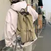 Bolso cubo con cordón de tela de nailon estilo coreano nuevo para mujer, mochila de viaje versátil, mochila escolar de gran capacidad para estudiantes, moda