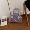 Bolso de axila para mujer, nueva colección de verano 2026, diseño de nicho, exquisito estampado de lunares, bolso de hombro, adecuado para ir al trabajo, bolso de mano tipo concha