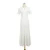 Vestido de punto de cuello redondo de estilo nuevo de verano inspirado en Chanel al por mayor, calado, con adornos de pedrería, ceñido a la cintura, de manga corta, línea A para damas elegantes