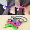Puesto de 2 yuanes muy vendido estilo coreano cuerda para el pelo de cuentas doradas con lazo anillo para el pelo de alta elasticidad tocado anudado cuerda para el pelo banda de goma