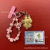 Llavero de tela con logo de empresa personalizado Cadena para teléfono móvil Angela Lámina de oro puro Oro 999 Regalo de aniversario