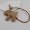Funda para teléfono con borla de cachorro linda creativa, correa para llavero de coche, accesorio para bolso, universal para teléfonos móviles