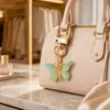 Bolsa Colgante de Mariposa Nueva de Verano 2026 Color Degradado Hebilla Metálica Disponible en Múltiples Colores