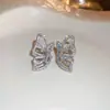 Aretes tipo cuff de diseño nicho de lujo ligero para mujer sin perforaciones, Aretes de mariposa y estrella de lujo ligero, Pendientes de moda estilo Ins