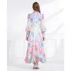 Vestido elegante estilo resort NATALIYA 2026 con cuello de blazer, estampado floral, mangas abullonadas, ceñido a la cintura y bajo con volantes