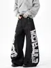 Pantalones Negros Transfronterizos con Estampado de Letras Estilo Americano, Costuras Visibles, Parches Desconstruidos, Corte Holgado, Pantalones Largos Únicos Estilo Urbano