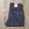 Calça jeans casual fina masculina de algodão penteado misto de cor clara, cintura média, micro elástica, para comércio exterior de verão