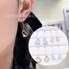 Nuevos y elegantes pendientes de perla tipo calabaza con borlas y montura calada para mujer, pendientes de alta gama, elegantes y a la moda al por mayor