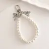 Nuevo Llavero de Perlas Colgante de Cuentas Colgante de Lazo Llavero de Oso con Lazo Placa Metálica Pulsera de Perlas