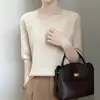 Suéter de tricô feminino transfronteiriço com gola redonda, novo estilo outono e inverno 2026, design vazado, mangas de três quartos, blusa básica pulôver solta, suéter fino