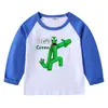 Camiseta infantil de primavera y otoño 2023, nueva camiseta de manga larga con cuello redondo y dibujos animados, camiseta de algodón para bebés y niños.