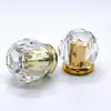 Los fabricantes suministran tapas de botellas de perfume de lujo ligero de alta gama, pegamento K, acrílico, PP, tapa de perfume tipo corona, se puede vender al por mayor, muestra