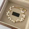 Pulsera de perlas barrocas de agua dulce en forma de pétalo para mujer, pulsera de cuentas de nicho de lujo ligero con un toque de alta gama, venta al por mayor
