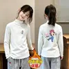 Top de niña con adorno de oreja de madera 2026 Nuevo estilo Niña Polar Casual Ropa interior Otoño Invierno Capa base Infantil Cepillado Manga larga