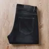 Estación europea verano fino negro azul súper suave antiarrugas cintura media-alta elástico para hombre casual de negocios jeans rectos
