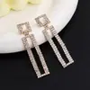 Comércio exterior estilo mais vendido brincos de corrente com garras de strass feminino brilho caixa de diamante brincos de luxo direto da fábrica E819