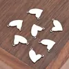 Colgante de acero inoxidable con doble agujero en forma de corazón, accesorio de lujo de alta gama estilo ins para pulsera y collar DIY, charm versátil para bolso pequeño