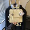 Mochila de lunares de nicho estilo coreano para mujer 2026 Nueva moda moderna Bolso de mano Mini mochila escolar casual para el día a día