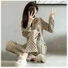 Traje Casual Deportivo Elegante de Gama Alta para Mujer 2025 Primavera y Otoño Nuevo Estilo Cardigan Pantalones de Pierna Ancha Modernos Conjunto de Dos Piezas